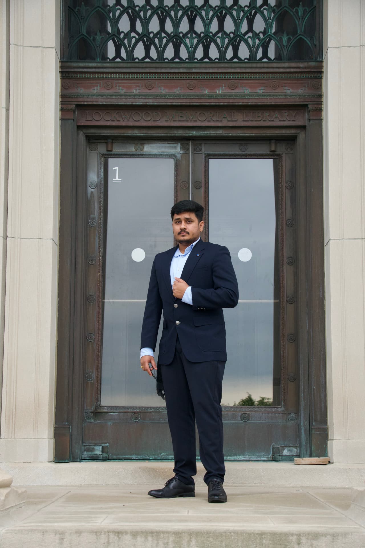 Portrait of Chinmaya Pasupuleti in professional attire